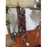 Oriental carved figure of a fisherman, which has been converted to a lamp, 61cm high, and another