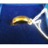 A 22ct gold band ring, hallmarked for London 1957, ring size J 1/2, weight 5.1g