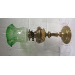 Brass oil lamp with a green shade, and chimney together with two spare chimneys