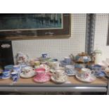 Quantity of miniature tea cups and saucers