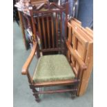 An oak slat back carver chair