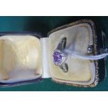 A 9ct white gold dress ring set with a heart shaped amethyst, marked 375 and control mark, ring size