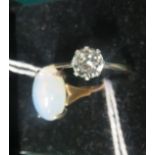 Two marked 9ct gold and SIL dress rings, one set with a large moonstone cabochon, and the other with