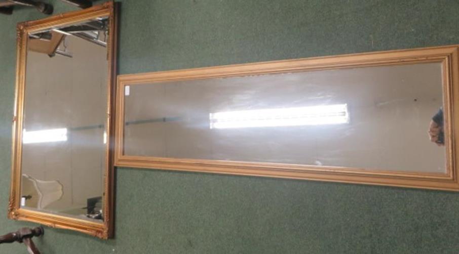 Gilt wall mirror, 59cm x 90cm together with another mirror, 112 x 29cm (2)