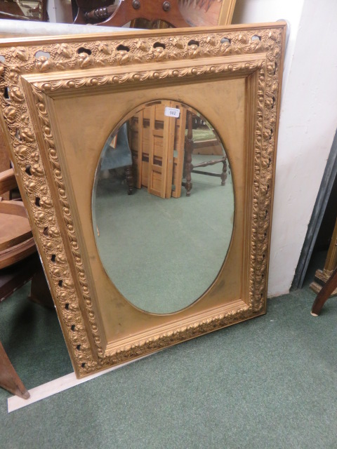 Antique gilt frame with later added gilt mirror, 105cm x 77cm