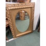 Antique gilt frame with later added gilt mirror, 105cm x 77cm