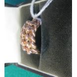 A 9ct rose gold Keeper ring, hallmarked for Chester 1911, maker's mark H.V.LD, ring size L 1/2,