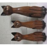 Three wooden seated cats
