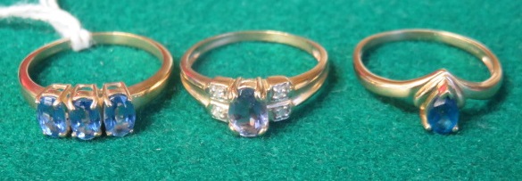A 9ct gold lolite and diamond ring, together with a 9ct gold apatite ring, and a 9ct gold Tibetan