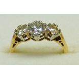 DIAMOND 3 - STONE RING IN SETTING MARKED 18CT Condition Report: Ring size: H.