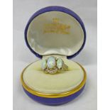 RING SET WITH 3 OPALS & SURROUNDED BY WHITE STONES & THE SETTING MARKED 585