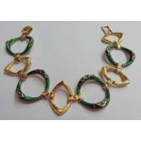 FANCY LINK DECORATIVE BRACELET STAMPED 750 CONSISTING OF GREEN ENAMEL & YELLOW GOLD LINKS,