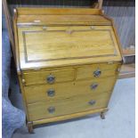 EARLY 20TH CENTURY BUREAU WITH FALL FRONT OVER 2 SHORT & 2 LONG DRAWERS ON SHAPED SUPPORTS