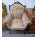 LATE 19TH CENTURY CARVED MAHOGANY FRAMED OVERSTUFFED ARMCHAIR ON SHAPED SUPPORTS,