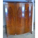 EARLY 20TH CENTURY MAHOGANY TRIPLE DOOR WARDROBE WITH SHAPED FRONT