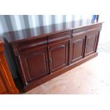 MAHOGANY SIDE CABINET WITH 4 DRAWERS & 4 PANEL DOORS BELOW ON PLINTH BASE.
