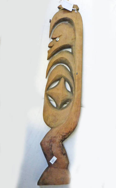 SEPIK RIVER CARVED WOODEN FIGURE WITH SHELL EYES Condition Report: 59cm long. 11.