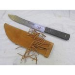 A GREEN RIVER STYLE KNIFE BLADE MARKED HAMMER FORGED MADE IN USA IN A BEADED AND FRINGED SCABBARD