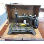 AMERICAN NATIONAL SEWING MACHINE WITH GILT DECORATION AND PORCELAIN HANDLE IN WOODEN BOX