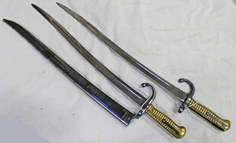 1874 AND 1875 FRENCH SWORD BAYONETS BOTH WITH SERIAL NUMBERS AND DATES TO THE BLADE ONE HAS