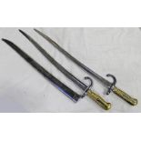 1874 AND 1875 FRENCH SWORD BAYONETS BOTH WITH SERIAL NUMBERS AND DATES TO THE BLADE ONE HAS