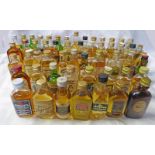 LARGE SELECTION OF WHISKY MINIATURES INCLUDING FAMOUS GROUSE, MACLEOD'S ISLE OF SKYE 8 YEA OLD,