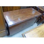 19TH CENTURY MAHOGANY DROP LEAF DINING TABLE ON SQUARE SUPPORTS