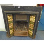 CAST IRON FIRE SURROUND WITH INSET TILES