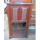 EARLY 20TH CENTURY MAHOGANY MUSIC CABINET WITH CARVED DECORATION & GLAZED PANEL DOOR