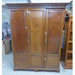 MAHOGANY TRIPLE DOOR WARDROBE WITH FITTED INTERIOR Condition Report: moulding to