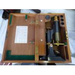 STUDENTS MONOCULAR MICROSCOPE OF BLACKENED HEAVY BRASS WITH SPARE OBJECTIVE LENSES,