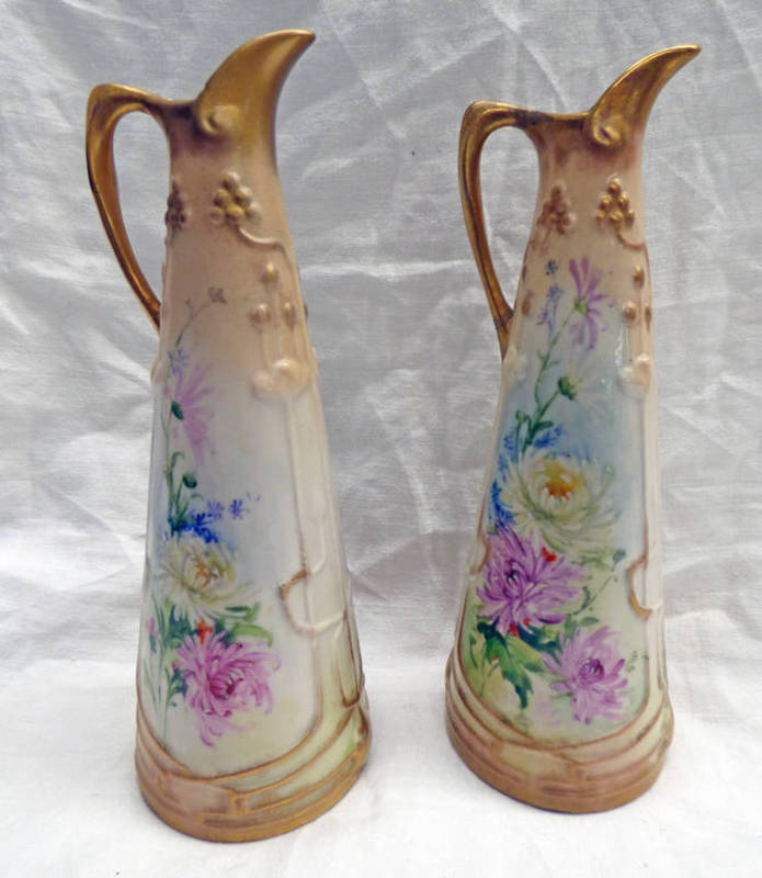 PAIR NAUTILUS PORCELAIN EWERS DECORATED WITH FLOWERS,