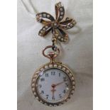 TURQUOISE AND PEARL SET FOB WATCH WITH A BORDER OF HALF PEARLS,