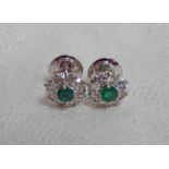 PAIR OF EMERALD AND DIAMOND EARSTUDS WITH CIRCULAR EMERALDS TO THE CENTRE SURROUNDED BY ROUND