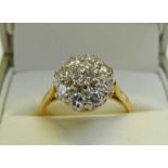 DIAMOND SET CLUSTER RING MARKED 18CT TOTAL DIAMOND WEIGHT OF APPROX 1.