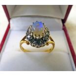 OPAL AND DIAMOND CLUSTER RING MARKED 750