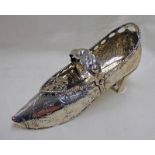 DUTCH WHITE METAL SHOE WITH EMBOSSED DECORATION