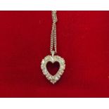 DIAMOND SET HEART PENDANT ON CHAIN MARKED 14K