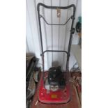 RED AND BLACK PETROL LAWN MOWER