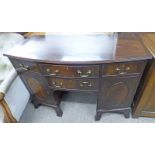 LATE 19TH CENTURY MAHOGANY BOW FRONT DESK WITH 4 DRAWERS AND 2 PANEL DOORS ON BRACKET SUPPORTS 114