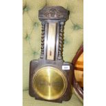 OAK ANEROID BAROMETER WITH BARLEY TWIST COLUMNS