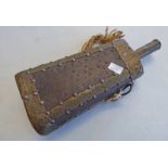 A MIDDLE EASTERN BRASS AND WOOD FLASK WITH STRING HANDLE,