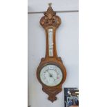 EARLY 20TH CENTURY CARVED OAK ANEROID BANJO BAROMETER