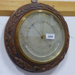 LATE 19TH / EARLY 20TH CENTURY CARVED OAK CIRCULAR BAROMETER WITH SILVERED DIAL BY NEGRETTI &