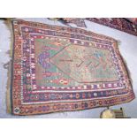 MIDDLE EASTERN GREEN AND RED RUG 210 X 150 CM Condition Report: Selection of holes