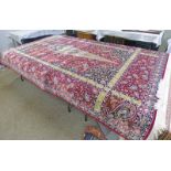 RED GROUND WOVEN SILK CARPET WITH TRADITIONAL ARABIC DESIGN APPROX 300 X 200CM Condition