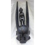 BAMBARA STYLE MASK WITH FEMALE FIGURE AND TWIN HORN CRESTING, PIERCING'S TO EARS,