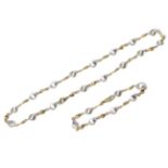 A 9 carat two colour gold necklace and bracelet set, formed of alternating matt white and polished
