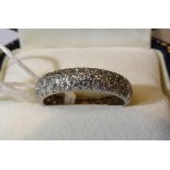 A diamond eternity ring, pavé set with three bands of eight-cut diamonds, total estimated diamond