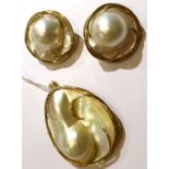 A mabe pearl suite, comprising a pendant and a pair of clip earrings, stamped '14K'